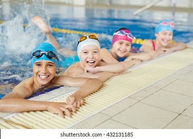 Happy Group Of Children Swimming Together