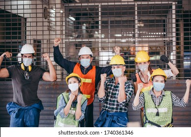 Happy Group Of Engineer Industrial Worker Wearing Protective Face Mask Celebrating After Factory Open. Success Business Teamwork Corporate Industry People. Lockdown Ending. New Normal Working Concept