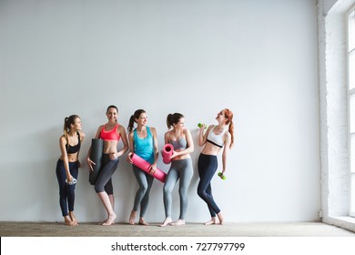 Happy Group Of Fit Women At The Gym. Fitness, Yoga, Exercise.