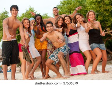 Happy Group Of Friends At The Beach