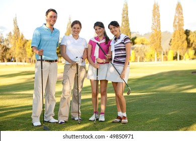 Happy Group Of Golf Players Outdoors And Smiling