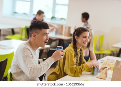 Happy Group Of High School Students At School Cafeteria