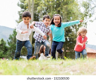 Happy Group Of Kids Playing At The Park 