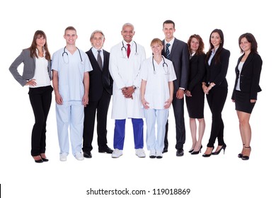 A happy group photo depicting a group of staff people. Isolated on white