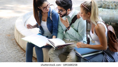 Happy Group Of Students Studying And Learning Together In College Outdoor