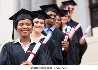 Happy Group Of University Graduates At Graduation Ceremony