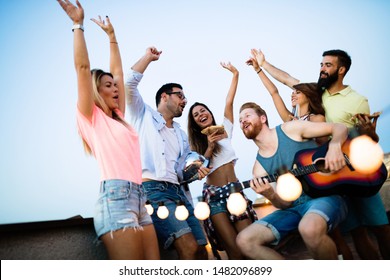 Happy Group Of Young Friends Having Fun In Summer