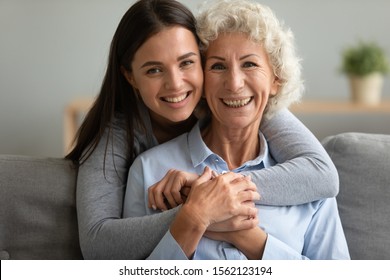 Happy Grown Granddaughter Hugging Senior Grandmother Stock Photo ...