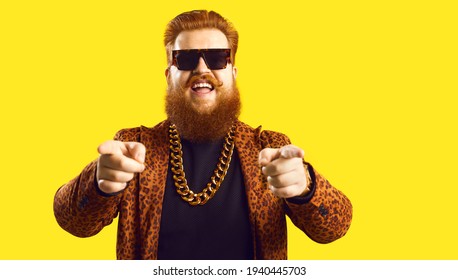 Happy Guy In Gold Necklace And Leopard Suit Pointing Fingers At Camera Isolated On Color Background. Famous Fashion Designer, Rich Showbiz Producer, Casting Director, Funny Celebrity Says I Choose You