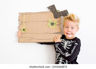 Happy Halloween Background With Blonde Boy And Halloween Decorations Over White Background