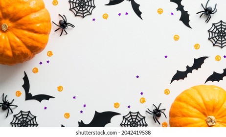 Happy Halloween Holiday Flat Lay Composition With Pumpkins, Spiders, Bats On White Background. Halloween Banner Mockup, Greeting Card Design.