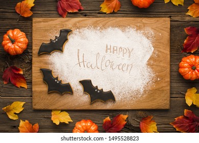 Happy halloween on wooden board with bats - Shutterstock ID 1495528823
