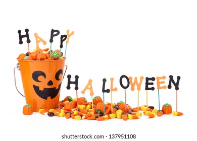 Happy Halloween Sign With Candy & Candy Bucket, Isolated On White, Copy Space 