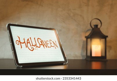 Happy Halloween the spookiest day of the year .handwriting on digital tablet display. - Powered by Shutterstock