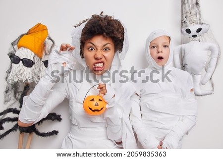 Similar – Foto Bild Happy Halloween.überrascht Kind in einem Skelett-Kostüm mit Popcorn gegen orange Hintergrund