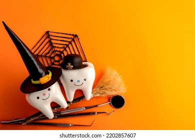 Happy halloween.dental concept.spider web pumpkin.dental tools on orange - Shutterstock ID 2202857607