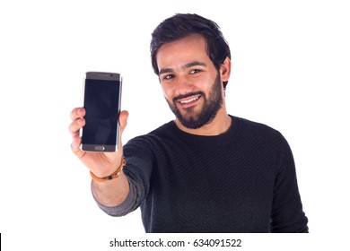 Happy Handsome Beard Young Man Smiling And Holding A Smart Phone, Guy Wearing Gray T-shirt, Isolated On White Background