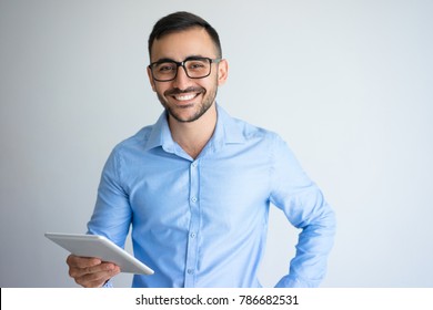 Happy Handsome Business Man Holding Tablet