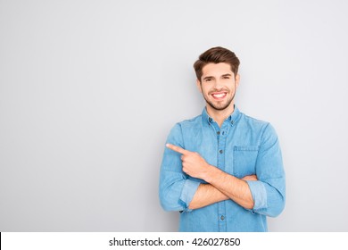 Happy Handsome Guy Showing Way And Pointing With Finger