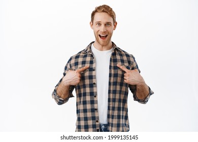 Happy Handsome Man With Red Hair Pointing At Himself, Smiling Pleased, Its Me, Promoting Personal Abilities, Choose Me Gesture, Standing Over White Background And Bragging