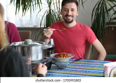 Happy Handsome Young Man Eating Delicious Chilli Rice 