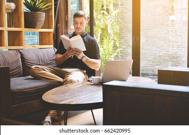 Happy Handsome Young Man Reading A Book In Cafe Shop Relax Time On Holiday ,color Of Hipster Style Selective And Soft Focus