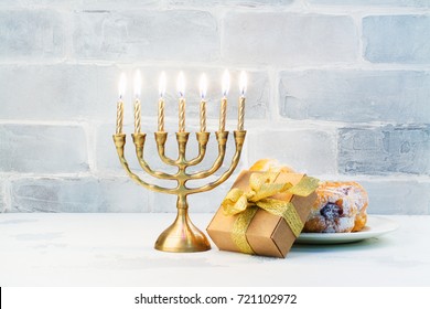Happy Hanukkah Background With Menorah, Burning Candles And Donuts. Space For Text