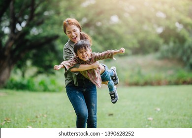 happy harmonious family outdoors concept.mother and son have activities together on holidays.