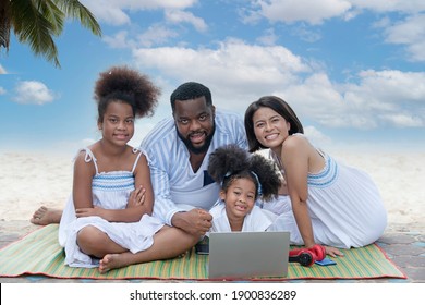 Happy And Healthy Asian Family Enjoy Picnic Travel Together On The Beach. Parents With Cute 2 Child Girl Having Fun On Summer Holiday Vacation. Holiday Concept.