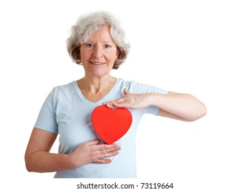 Happy Healthy Elderly Woman Holding A Red Heart