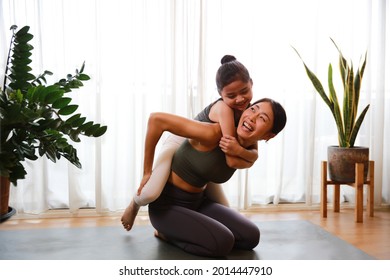 Happy and Healthy famly Mother and little daughter practice yoga and fitness at home, healthy exercise during lock down period 