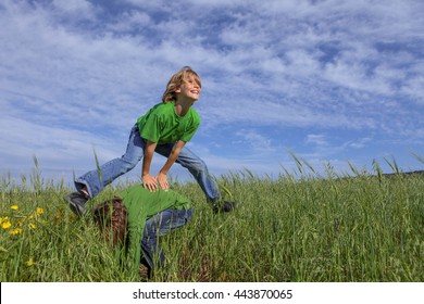 Happy Healthy Kids Playing Leapfrog Summer Game