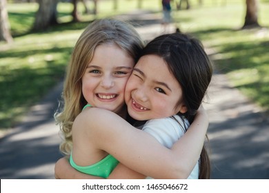 Happy And Healthy Mixed Race Children  Girls Hugging And Smiling In The Park, Best Friends And Positive Friendship , Girl Power, Best Friends Forever,all Lives Matter, No To Racism, Diversity Concept