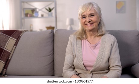 Happy Healthy Old Woman Smiling Camera Sitting Sofa, Retirement Wellness, Beauty