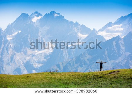 Happy hiker enjoying the view. Caucasus Mountains