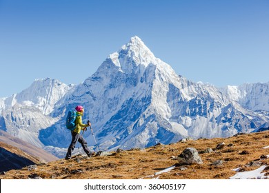 Happy hiker walking in the mountains, freedom and happiness, achievement in mountains. Himalayas, Everest Base Camp trek, Nepal