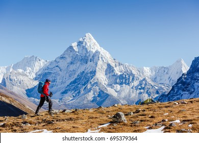 Happy Hiker Walking In The Mountains. Himalayas, Everest Base Camp Trek, Nepal