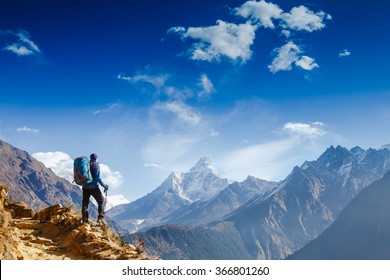 Happy hiker winning reaching life goal, success, freedom and happiness, achievement in mountains. Himalayas. Nepal - Shutterstock ID 366801260