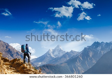 Happy hiker winning reaching life goal, success, freedom and happiness, achievement in mountains. Himalayas. Nepal