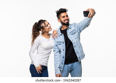 Happy Hipster Couple Taking A Selfie On White Background