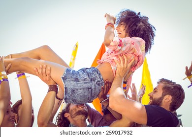 Happy Hipster Woman Crowd Surfing At A Music Festival