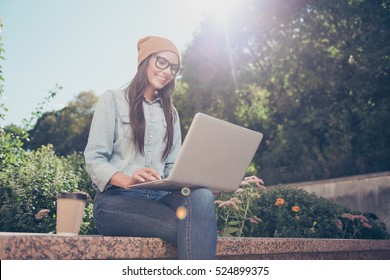 Happy Hipster Young Woman Working On Laptop In The Park