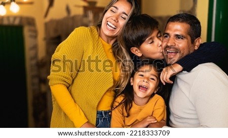 Happy Hispanic family having fun together