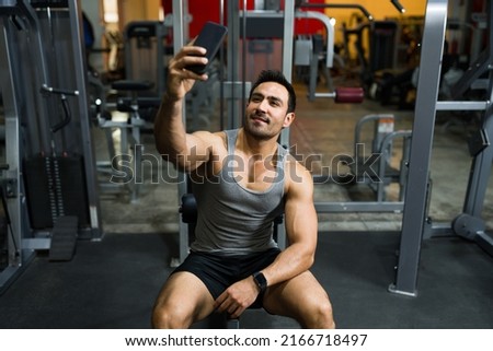 Similar – Image, Stock Photo man taking a weight plate in a gym