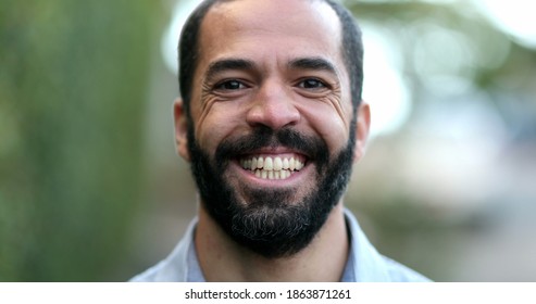 Happy Hispanic Man Walking Outside Smiling