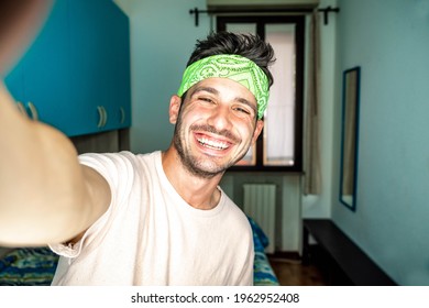 Happy Hispanic Millennial Man Making Video Call At Home - Young Guy Taking A Selfie Smiling At Camera Indoor - People, Vlog, Influencers And Dating Online Concept