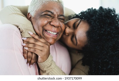 Happy Hispanic mother and daughter having tender moment together - Parents love and unity concept