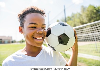 A Happy Hispanic Soccer Player Outdoor In Sunny Day