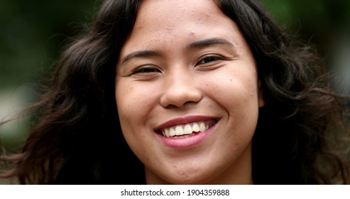 Happy Hispanic Woman Standing Outside At Park Smiling At Camera. Mixed Race Latina Girl Portrait Face, Casual Real People Series