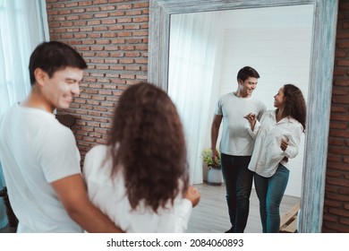 Happy Hispanic Young Couple Having Fun Dancing Samba In Bedroom, Enjoying The Dance On Weekend At Home